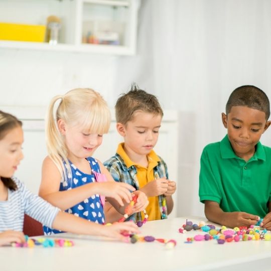  73_9282_02Jun2022113541_Children Stringing Beads 540px.jpg